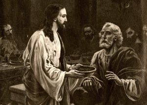 Jesus offers Judas the bowl to dip the bread in as Judas gives a worried look