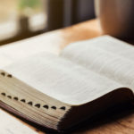 Picture of open Bible that any common person can interpret