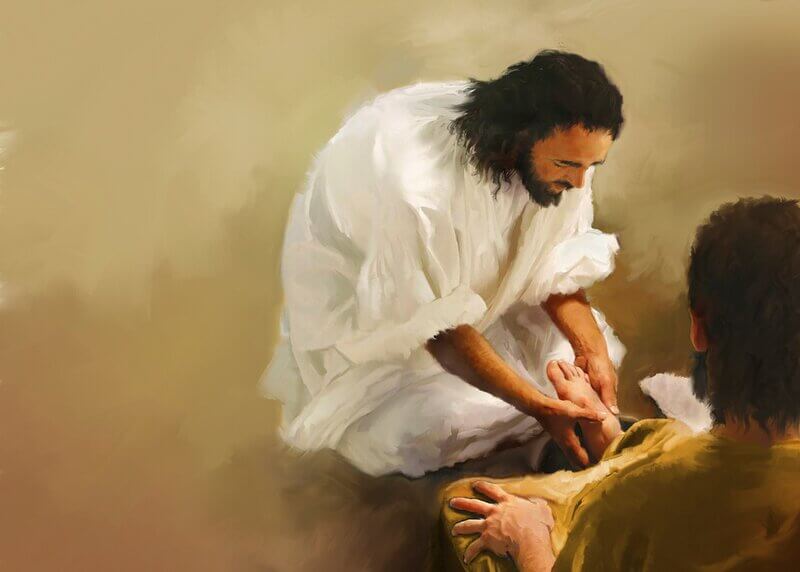 Jesus washing a disciple's feet demonstrates how believers should love and serve one another
