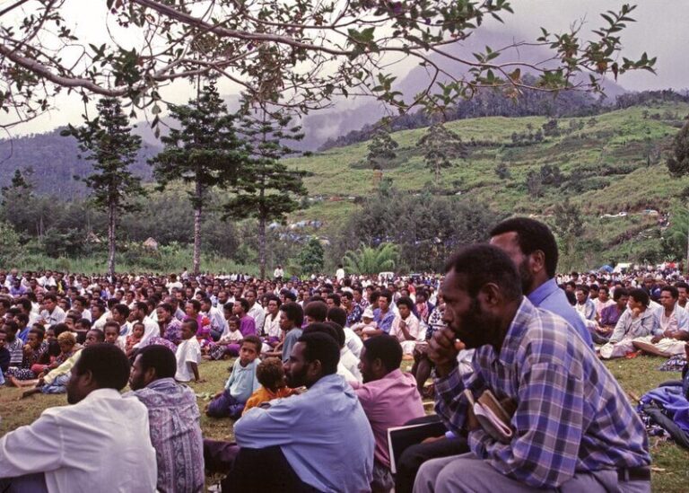 Outdoor service in Papua New Guinea with many believers congregating showing God's chosen people and holy nation worshipping in God's presence.